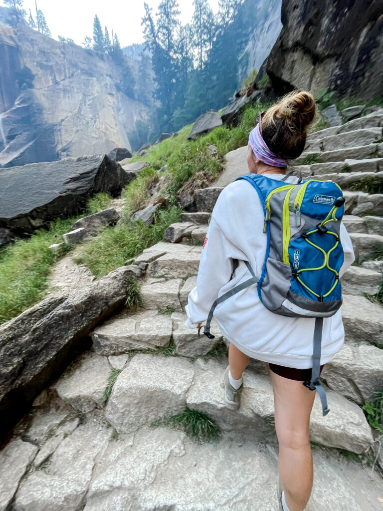 girl hiking with backpack