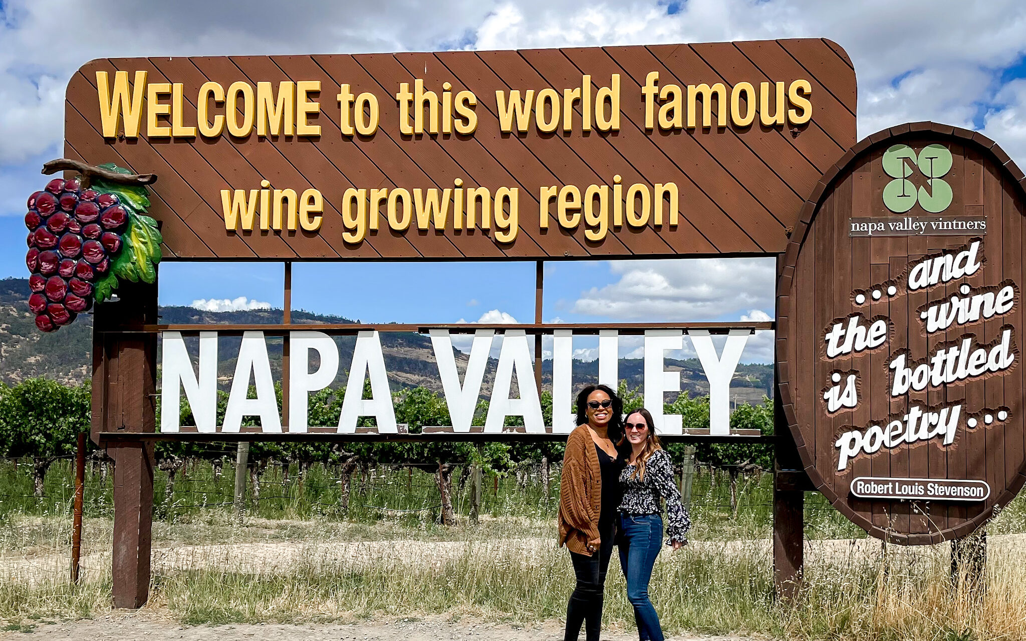girls at the Welcome to Napa Valley sign