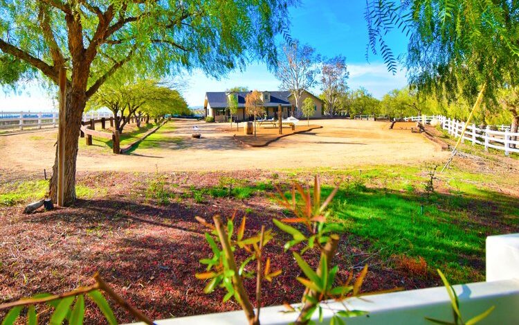 Guest house in Temecula on a ranch with a white picket fence and trees