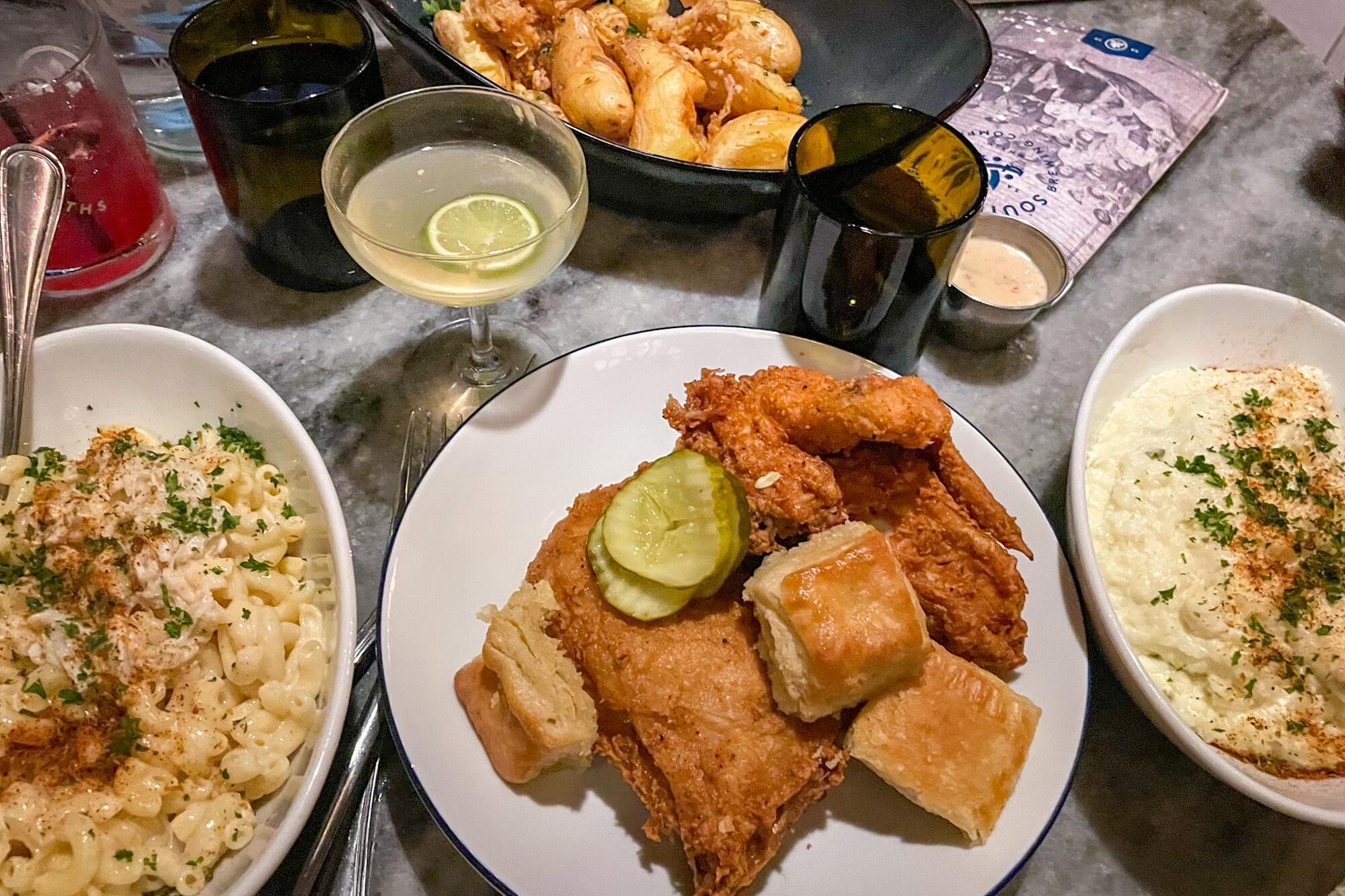 Fried chicken, grits, Mac and cheese, potatoes, and cocktails at Southerleigh