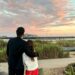 man and woman in front of sunset on the pier in Santa Barbara