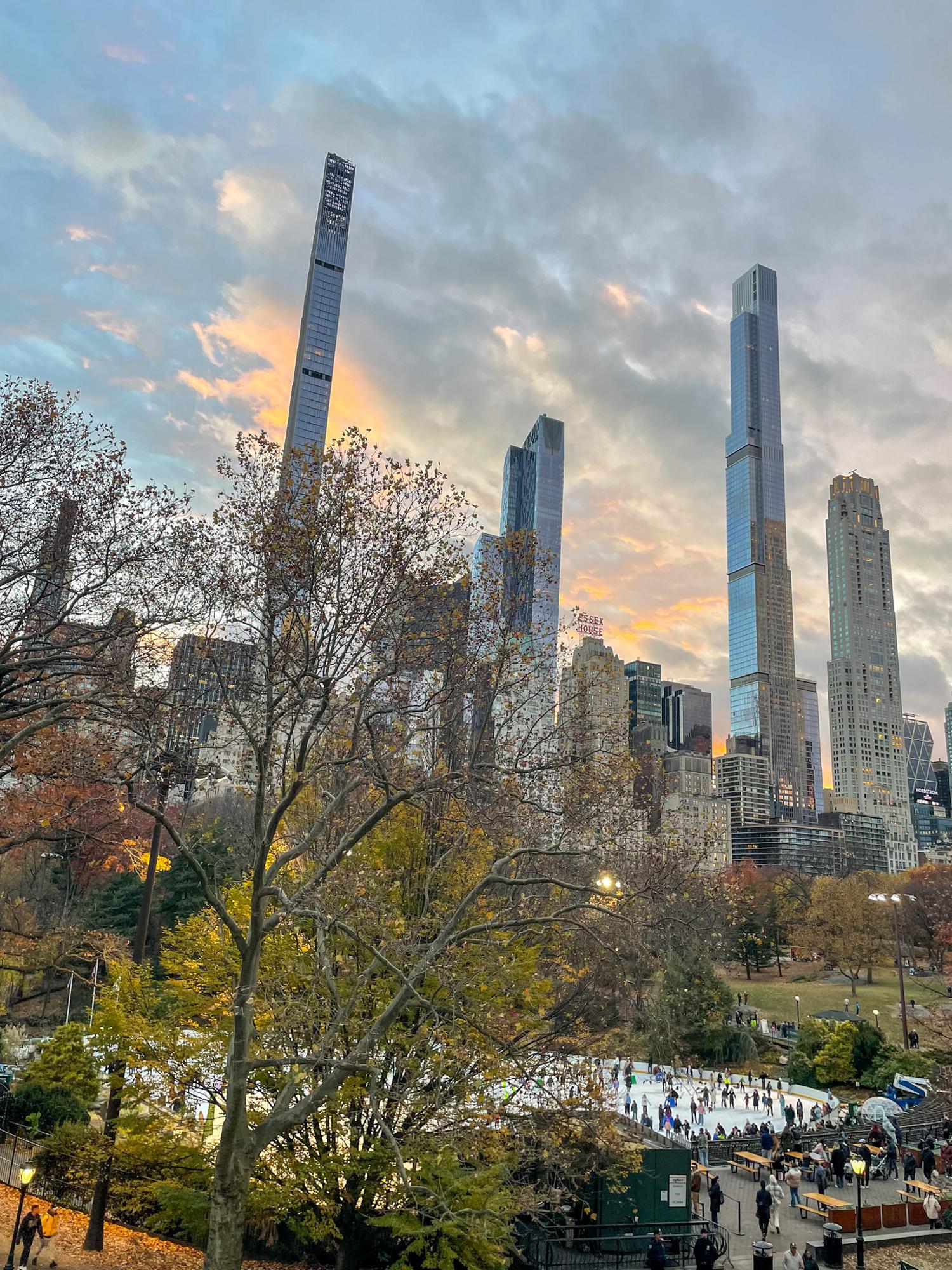 Central Park ice skating and skyline